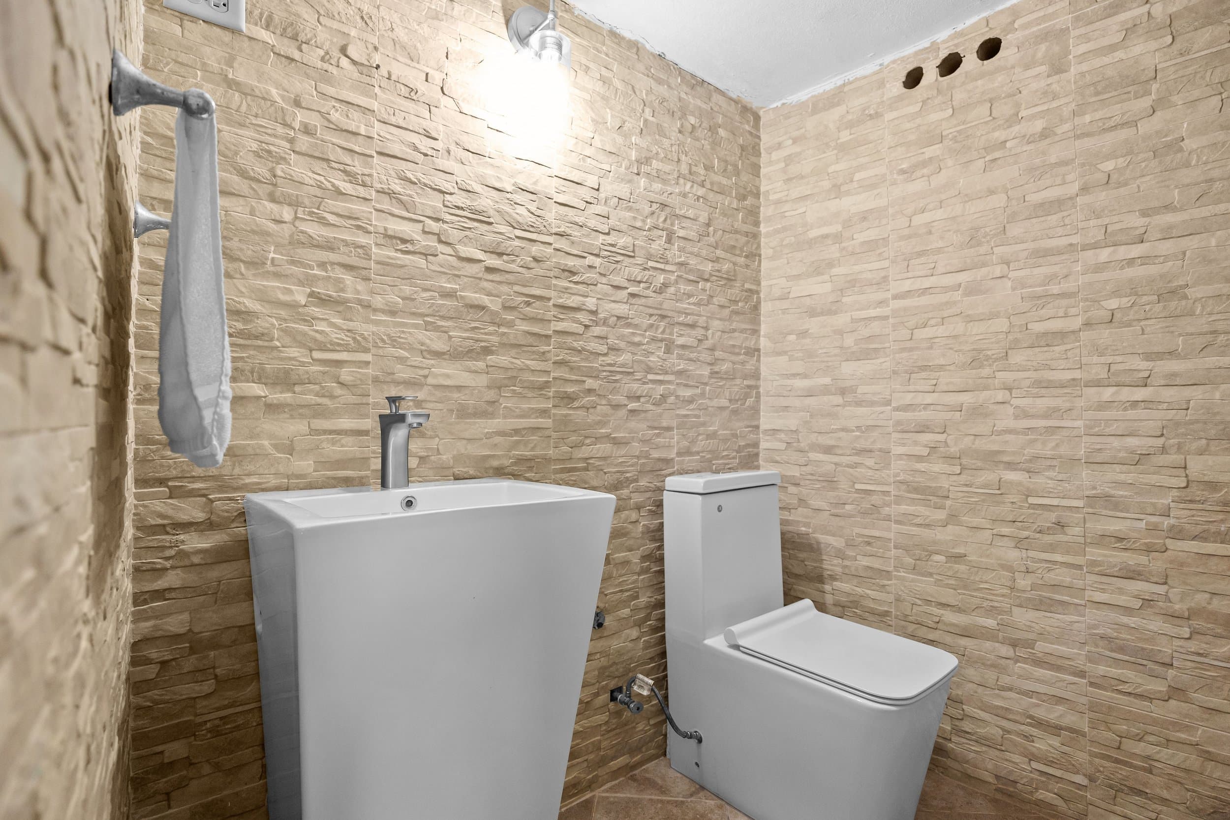 Stone-clad powder room