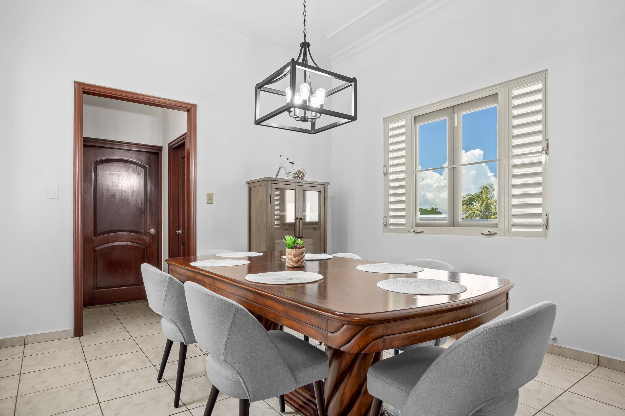 Formal dining room under lantern pendants