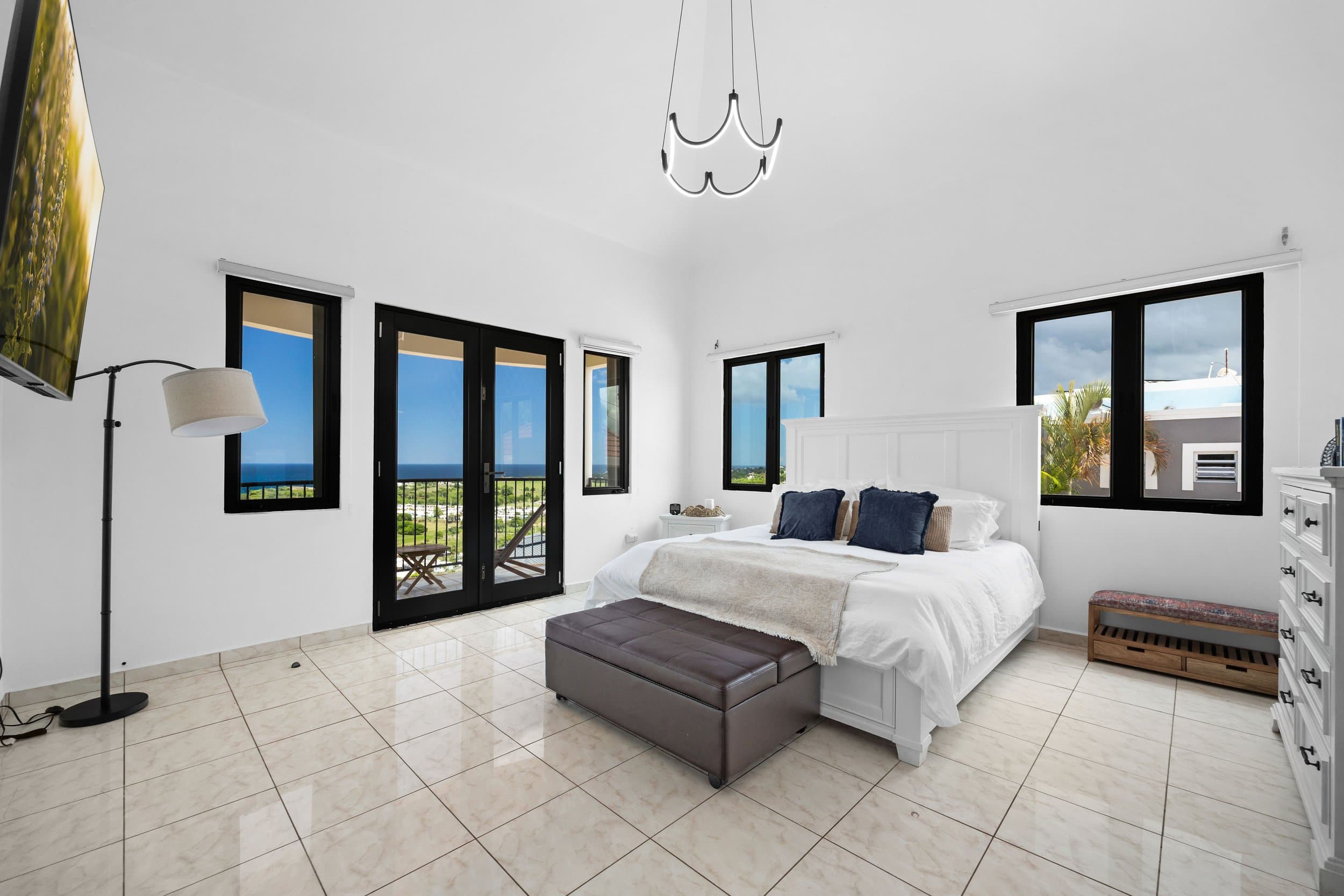 King bedroom with private balcony access