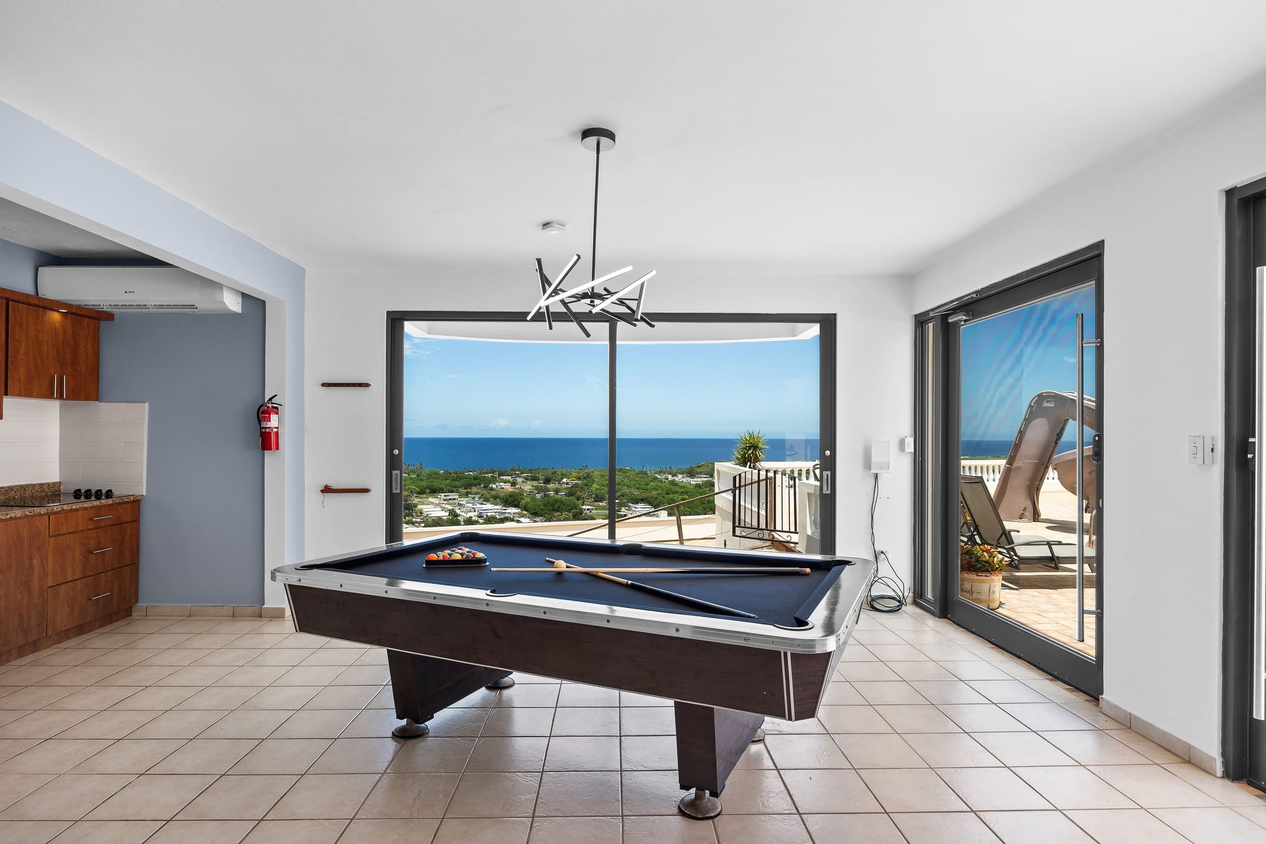 Billiards with a view of the pool deck