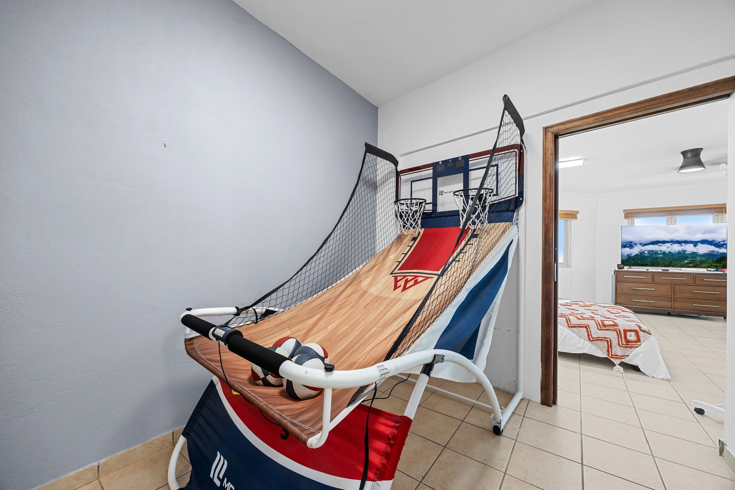 Arcade basketball machine in the game room