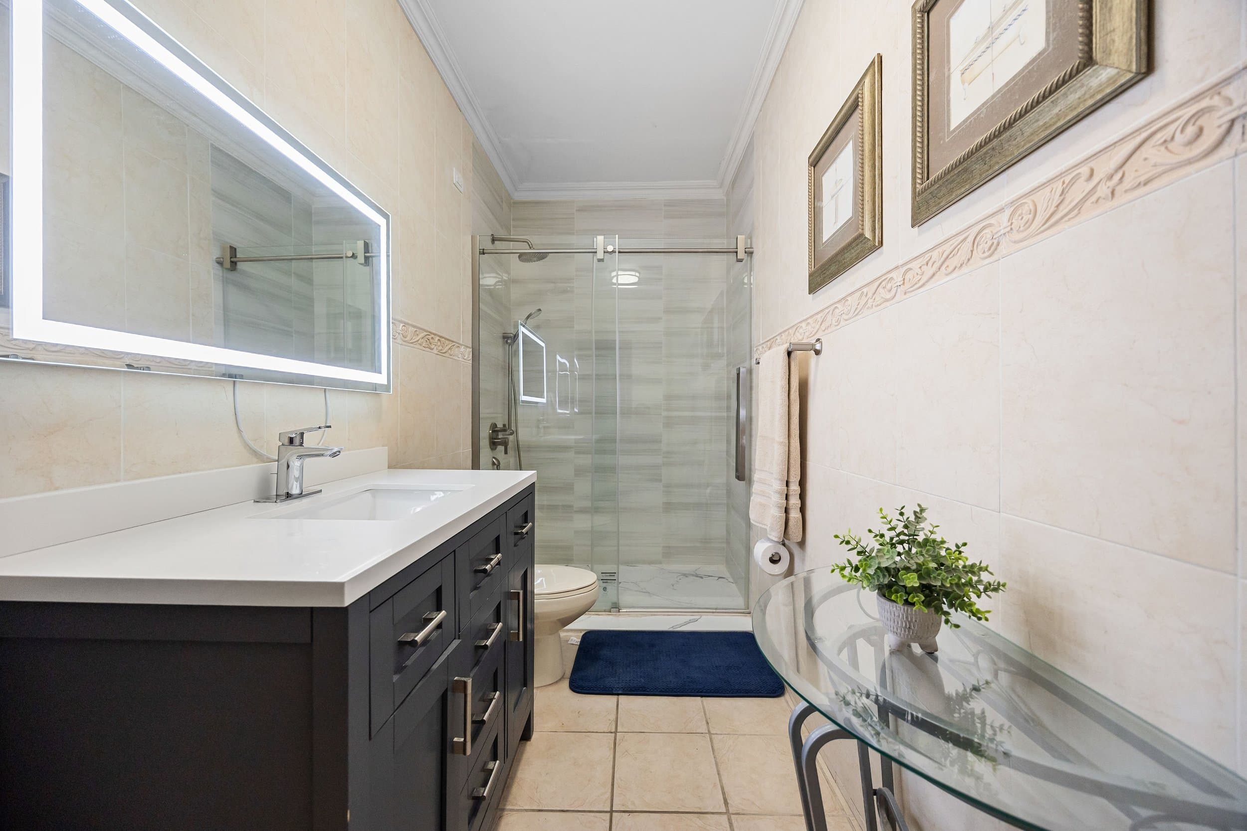 Bathroom with backlit mirror