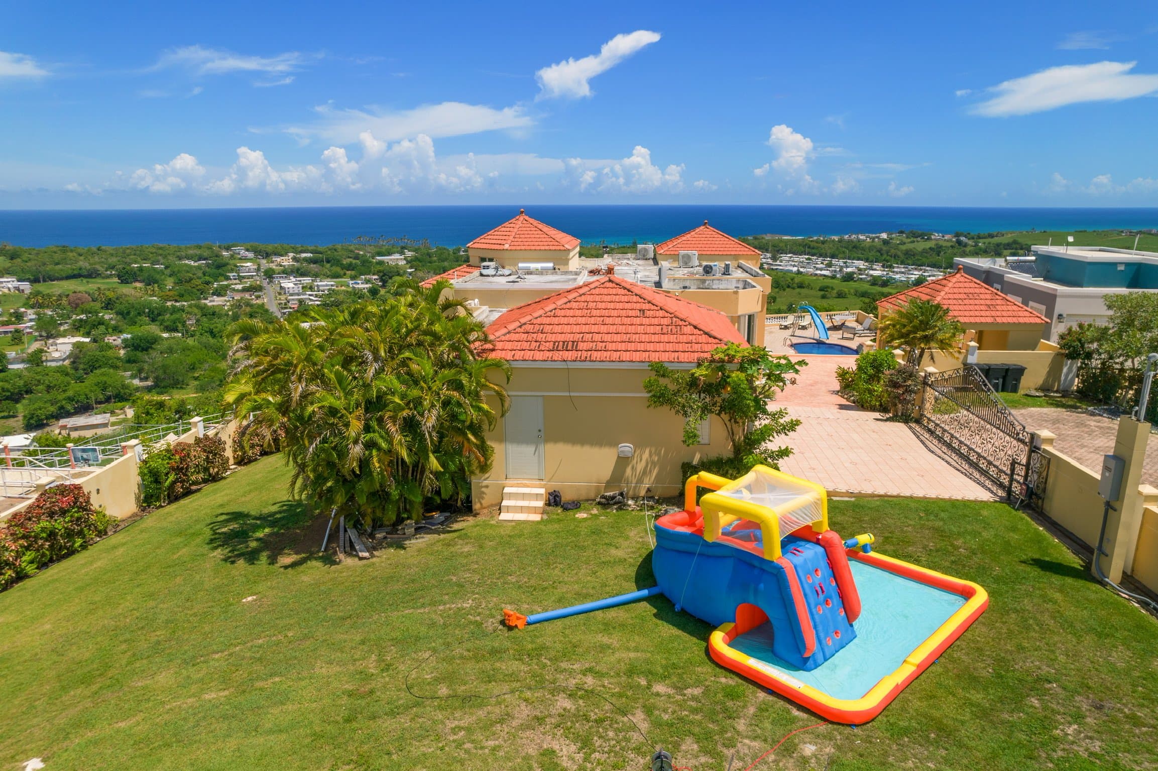 Kids' inflatable mega waterpark on the villa lawn