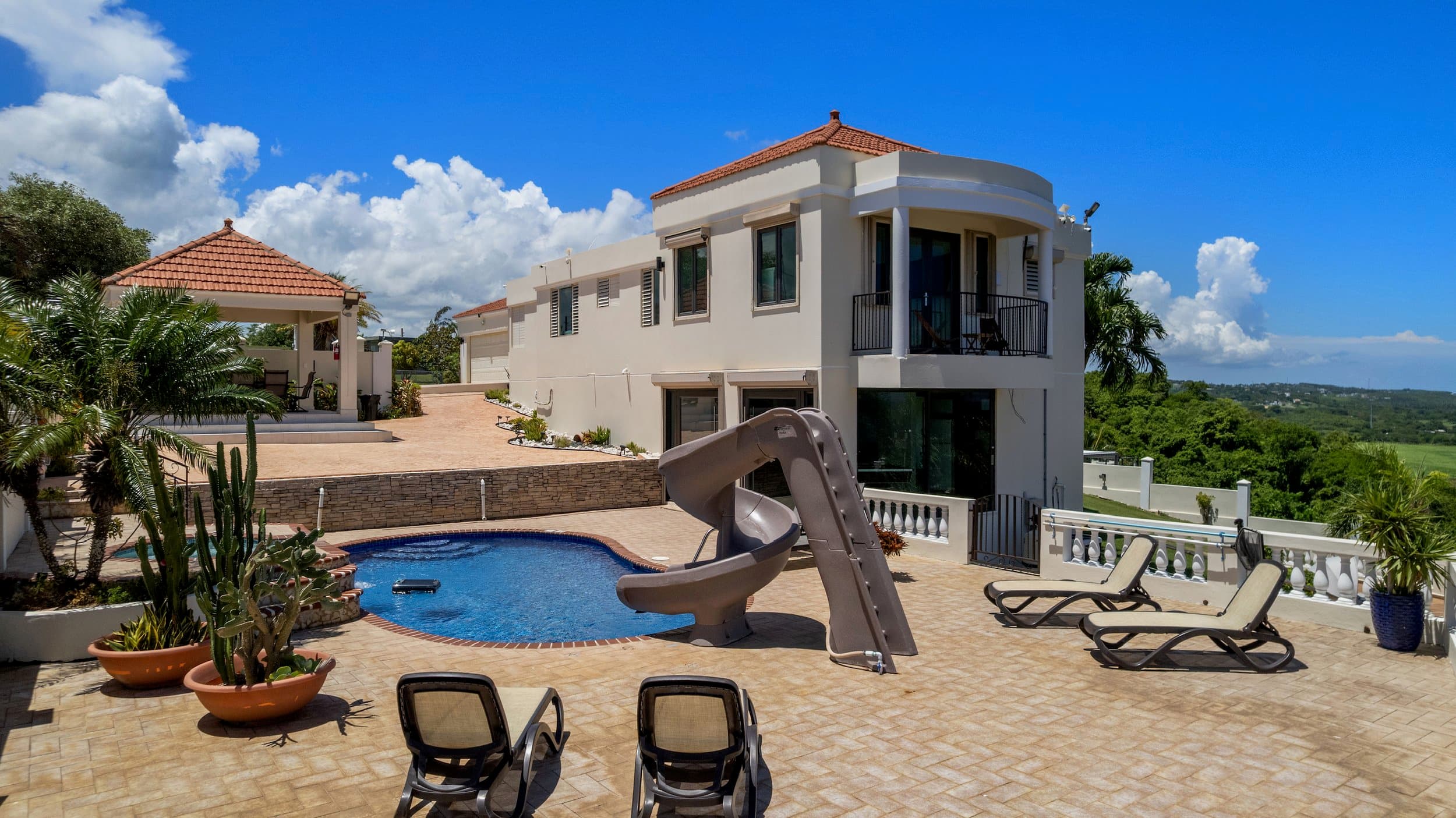 Villa facade with pool and waterslide