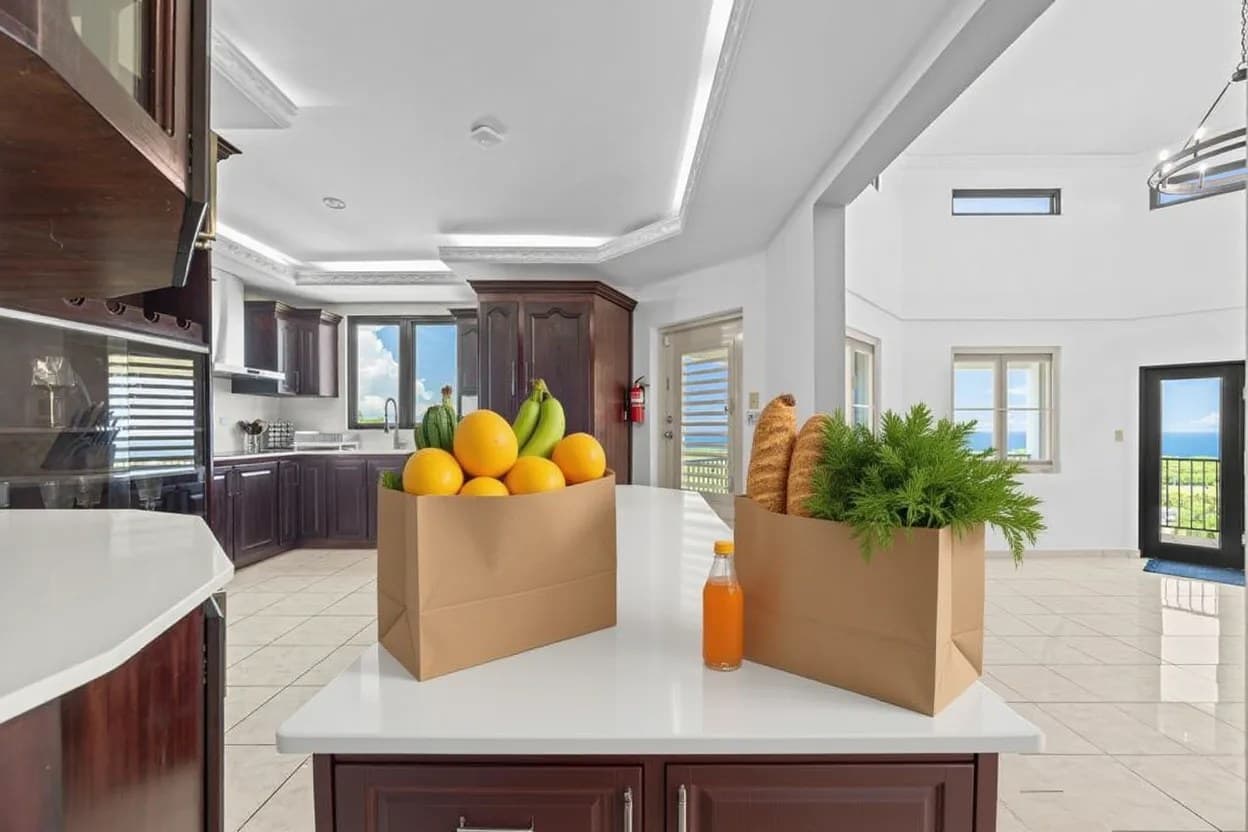 Fresh groceries in paper bags on the villa kitchen counter