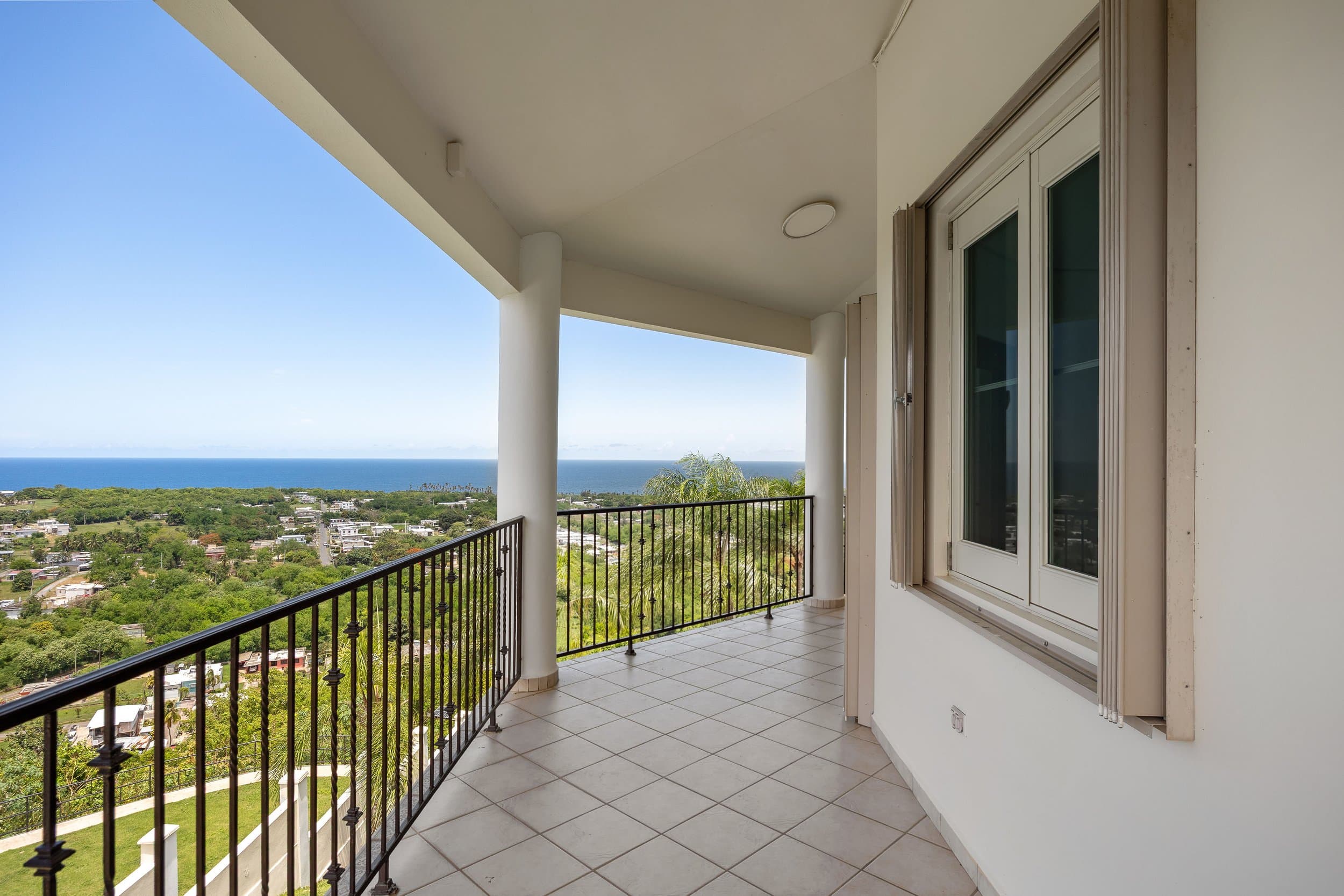 Balcony over the green valley to the sea